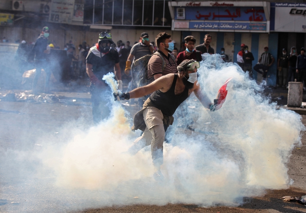 Iraqis take part in a rally in the central holy city of Najaf on Friday to show solidarity with anti-government protesters in the capital Baghdad. — AFP