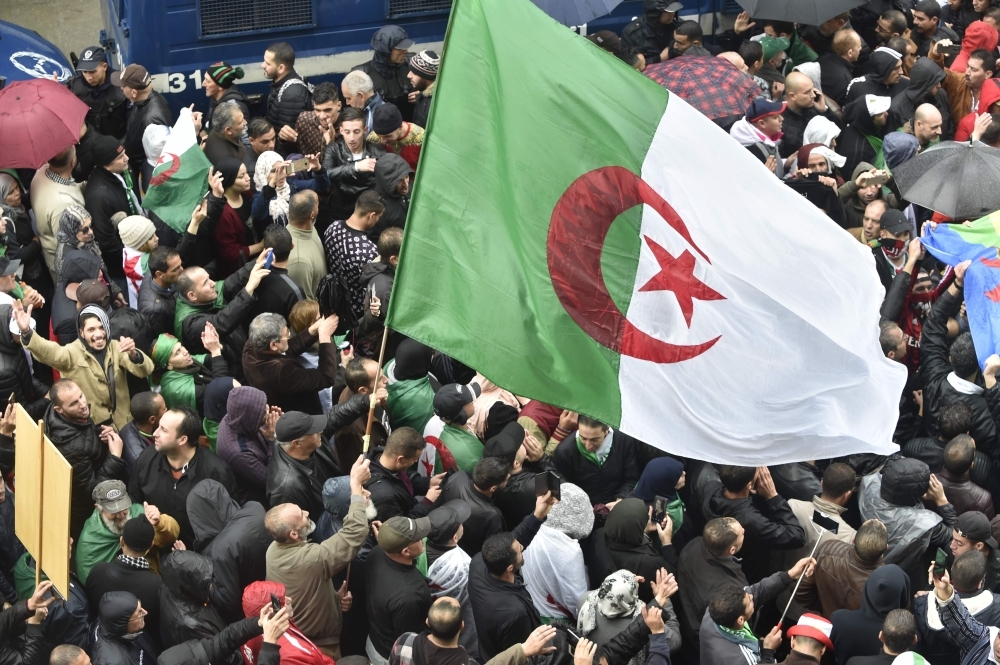 Algerian protesters rally to reiterate their opposition to a presidential election in Algiers on Friday. — AFP