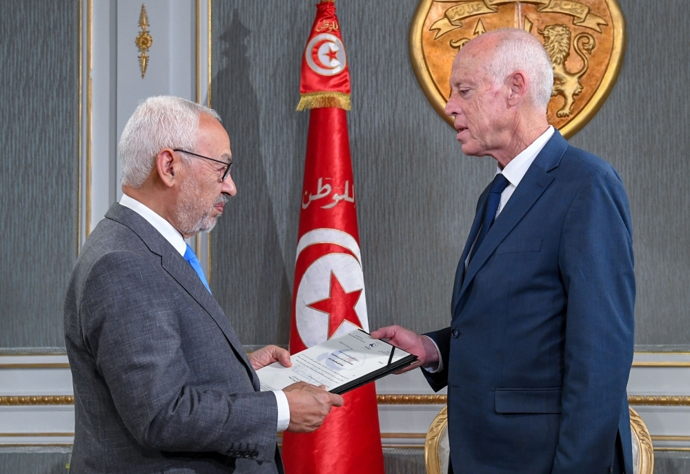 Tunisia's President Kais Saied, right, receives Ennahdha leader and parliament speaker Rached Ghannouchi at the presidential palace in the capital's eastern suburb of Carthage on Friday. — AFP