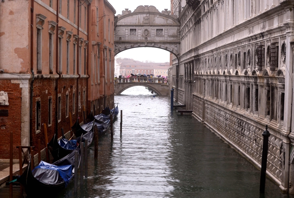 A general view shows the flooded St. Mark's Square, with St. Mark's Basilica (Rear L) and the Bell Tower on Saturday in Venice, two days after the city suffered its highest tide in 50 years. — AFP