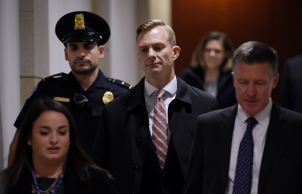 David Holmes, a State Department official, arrives to appear in a closed-door deposition hearing as part of the impeachment inquiry at the US Capitol in Washington, DC, on Friday. — AFP