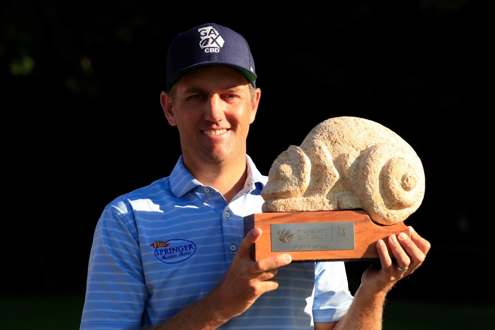 Brendon Todd of the United States celebrates with the trophy on the 18th green after winning the Mayakoba Golf Classic at El Camaleon Mayakoba Golf Course in Playa del Carmen, Mexico on Monday. — AFP
