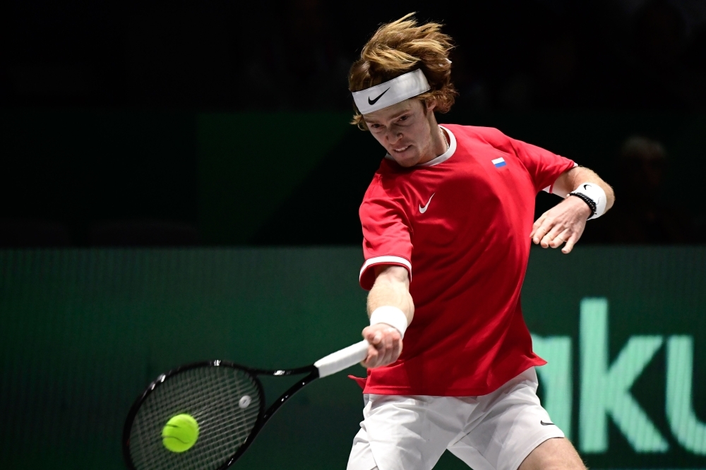 Russia's Karen Khachanov returns the ball to Croatia's Borna Coric during the singles tennis match between Croatia and Russia at the Davis Cup Madrid Finals 2019 in Madrid on Monday. — AFP
