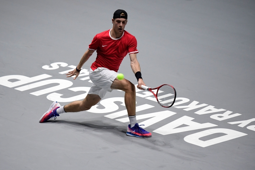 Russia's Karen Khachanov returns the ball to Croatia's Borna Coric during the singles tennis match between Croatia and Russia at the Davis Cup Madrid Finals 2019 in Madrid on Monday. — AFP