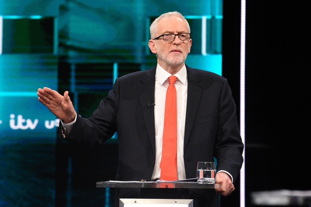 Britain's Prime Minister Boris Johnson (L) and Britain's Labour Party leader Jeremy Corbyn (R) debate on the set of 