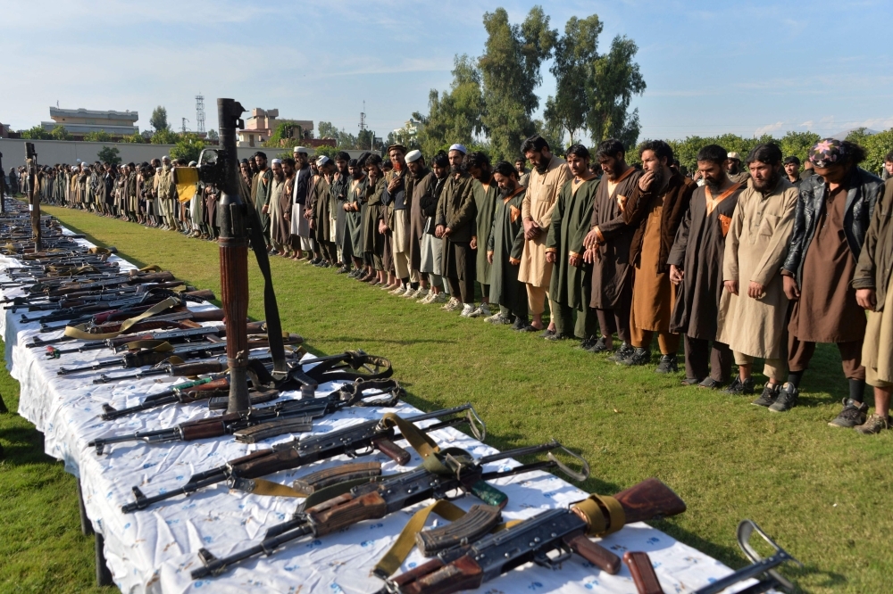Members of Daesh (the so-called IS) stand alongside their weapons, following they surrender to Afghanistan's government in Jalalabad, capital of Nangarhar Province, Afghanistan, in this Nov. 17, 2019 file photo.  — AFP