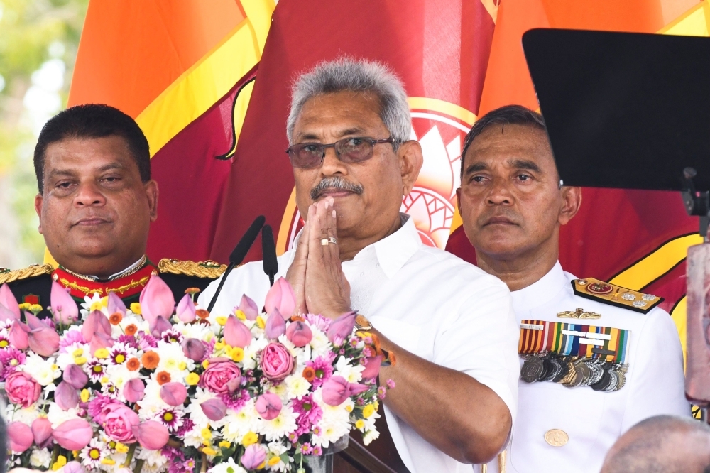 Sri Lanka's new president Gotabaya Rajapaksa, center, gestures after addressing the nation during his swearing-in ceremony at the Ruwanwelisaya temple in Anuradhapura, Sri Lanka, in this Nov. 18, 2019 file photo. — AFP
