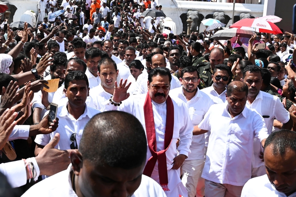 Sri Lanka's new president Gotabaya Rajapaksa, center, gestures after addressing the nation during his swearing-in ceremony at the Ruwanwelisaya temple in Anuradhapura, Sri Lanka, in this Nov. 18, 2019 file photo. — AFP