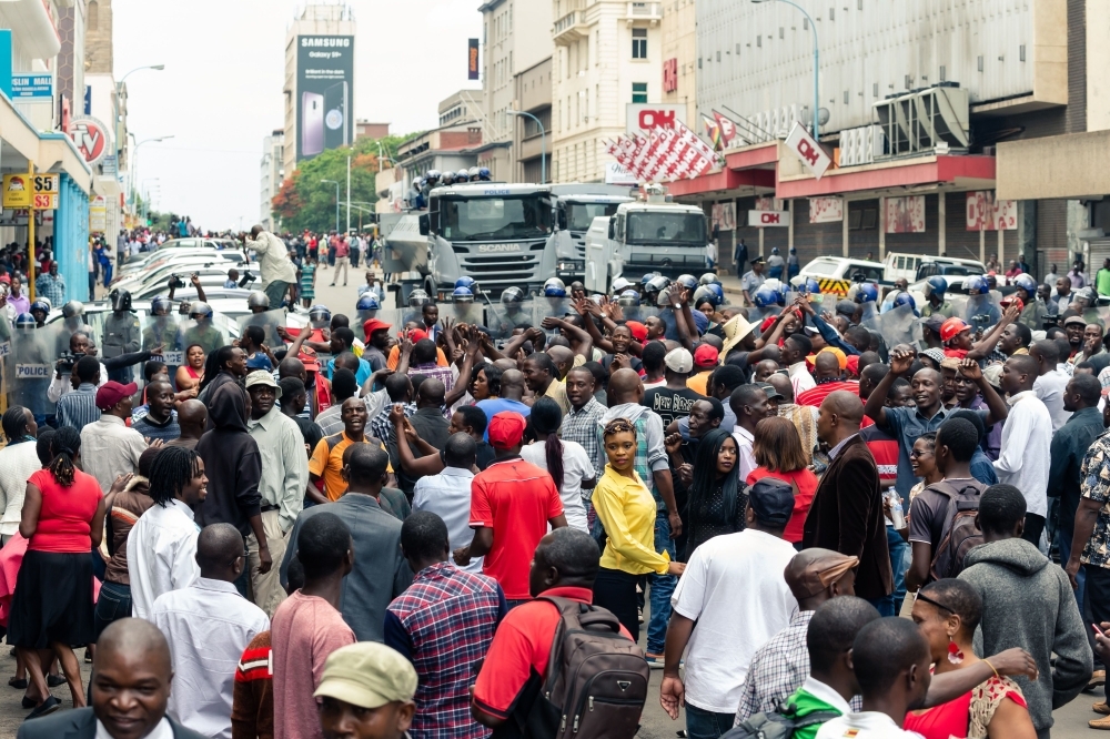 Supporters of Zimbabwe opposition leader of the MDC (Movement for Democratic Change) Alliance, Nelson Chamisa, at the Morgan Tsvangirai House the party headquarters, in Harare, on Wednesday. — AFP