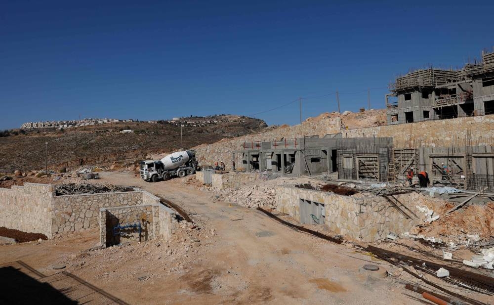 A picture taken on Tuesday from the Israeli settlement of Psagot overlooking the Palestinian West Bank city of Ramallah. —  AFP