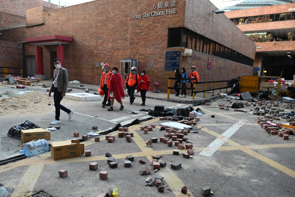 A barricade is seen at the campus of the Hong Kong Polytechnic University where dozens of pro-democracy protesters remain holed up inside, in the Hung Hom district of Hong Kong, on Thursday. — AFP
