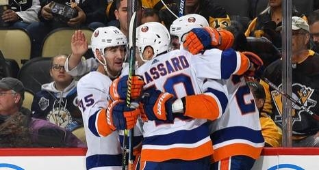 The New York Islanders players celebrate after staging a fine rally against the Pittsburgh Penguins.