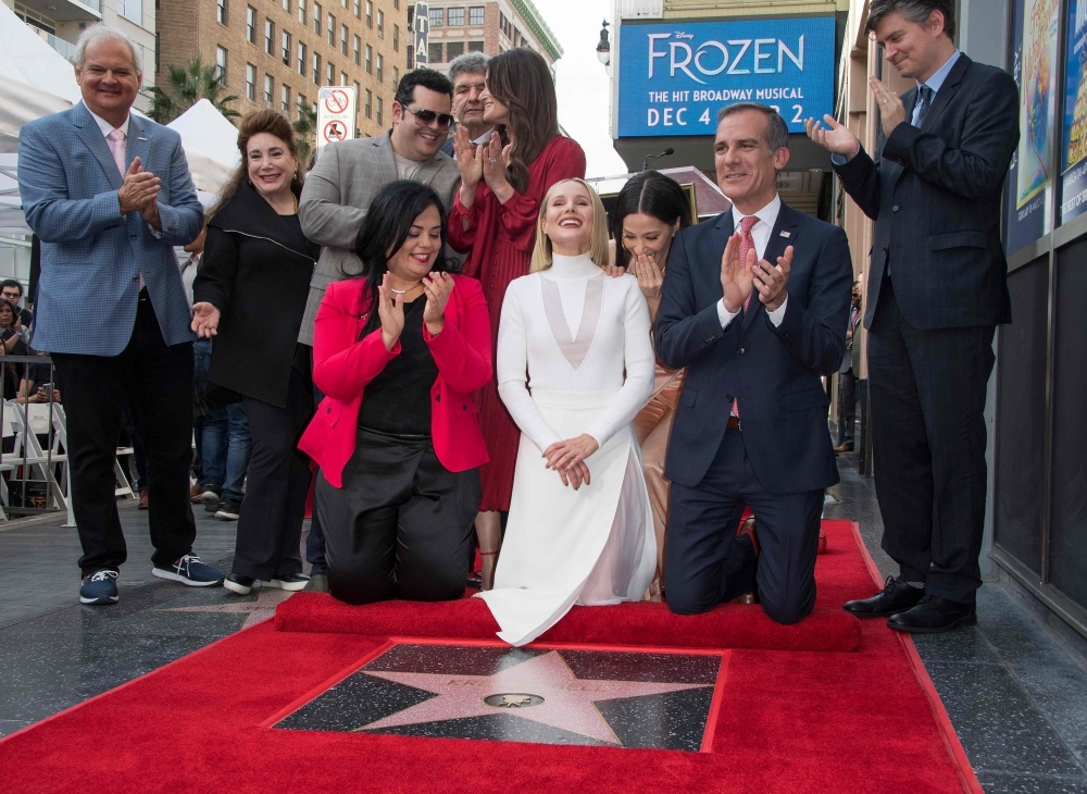 Idina Menzel, left, Mayor Eric Garcetti, center, and Kristen Bell, right, on The Hollywood Walk of Fame in Hollywood, California, in this Nov. 19, 2019 file photo. — AFP