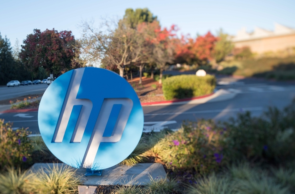 In this file photo taken on Nov. 4, 2016 the HP logo is seen on a sign at Hewlett Packard's headquarters in Palo Alto, California. — AFP