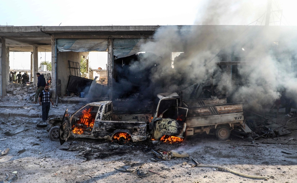 This picture taken on Saturday shows the aftermath of a car bomb explosion at the industrial zone in the northern Syrian town of Tal Abyad, on the border with Turkey. -AFP