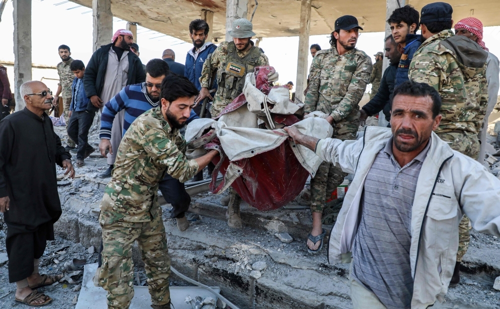 This picture taken on Saturday shows the aftermath of a car bomb explosion at the industrial zone in the northern Syrian town of Tal Abyad, on the border with Turkey. -AFP
