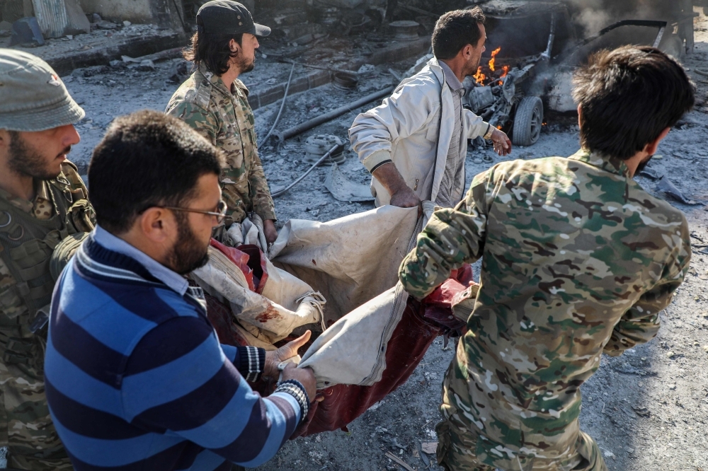 This picture taken on Saturday shows the aftermath of a car bomb explosion at the industrial zone in the northern Syrian town of Tal Abyad, on the border with Turkey. -AFP