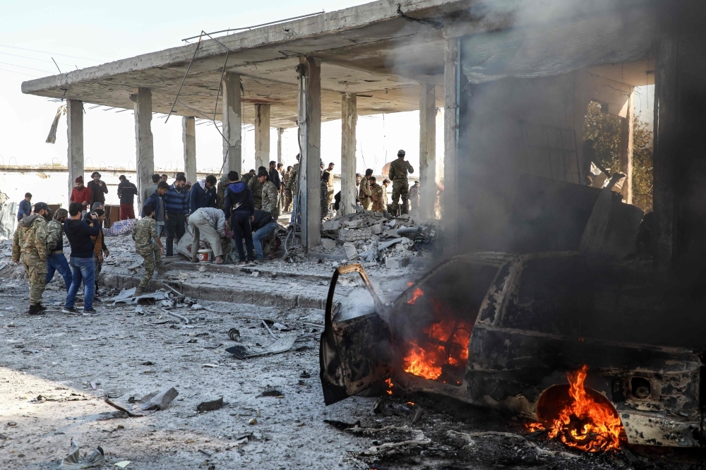 This picture taken on Saturday shows the aftermath of a car bomb explosion at the industrial zone in the northern Syrian town of Tal Abyad, on the border with Turkey. -AFP