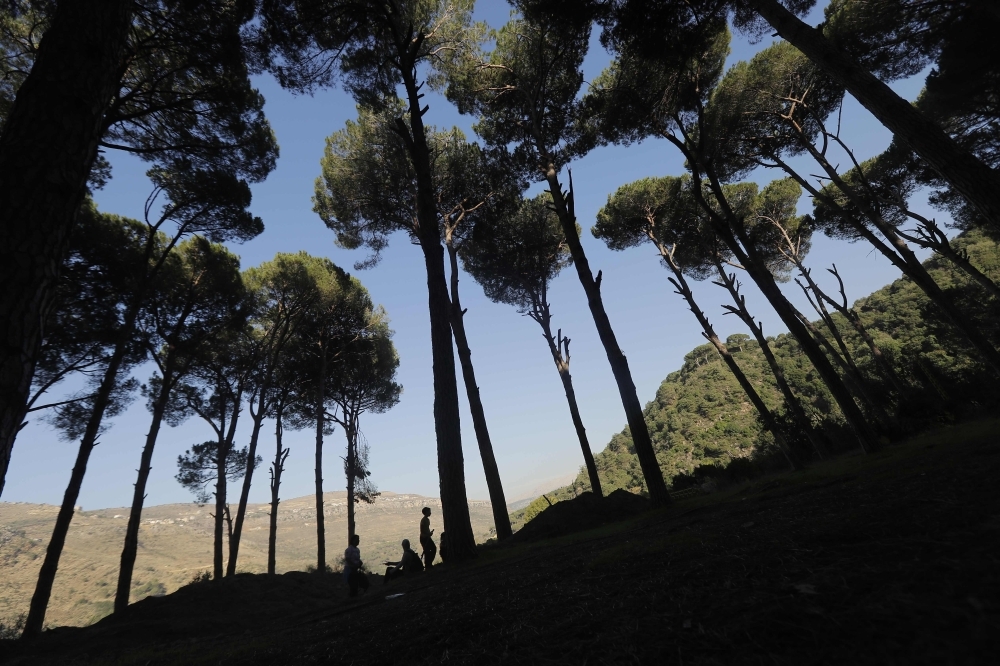 A young Lebanese man rides a horse as protesters take a break during a 20km march in the Bisri Valley, southwest of the capital Beirut on November 22, 2019, to protest against the construction of a dam in the area. -AFP