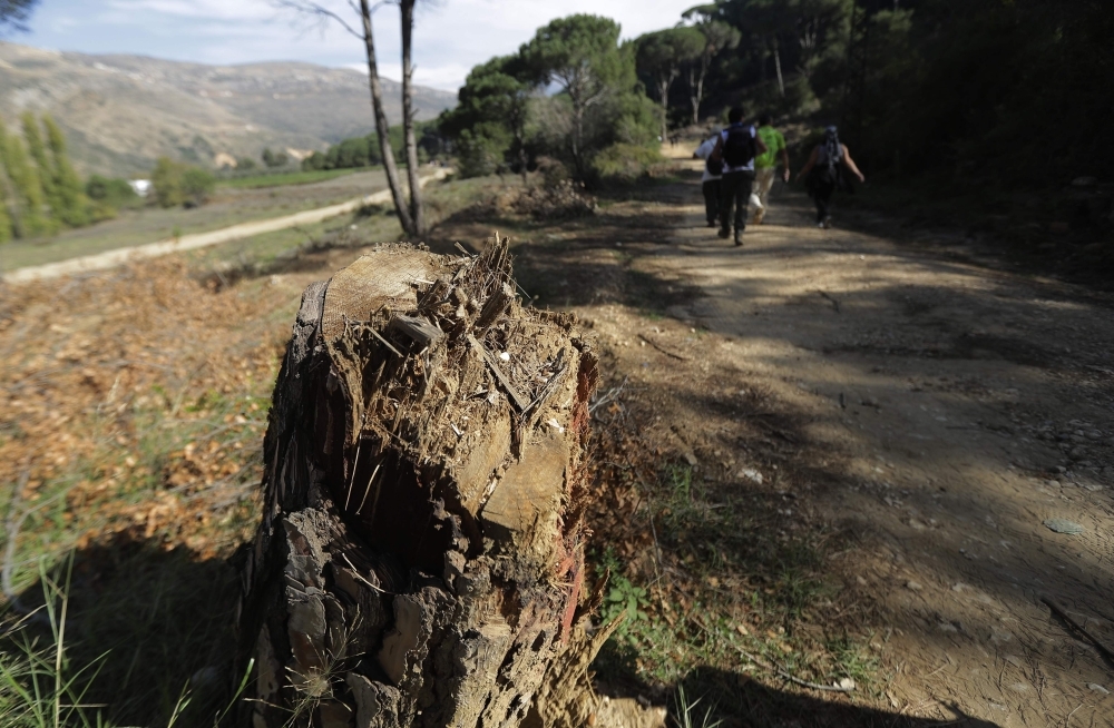 A young Lebanese man rides a horse as protesters take a break during a 20km march in the Bisri Valley, southwest of the capital Beirut on November 22, 2019, to protest against the construction of a dam in the area. -AFP