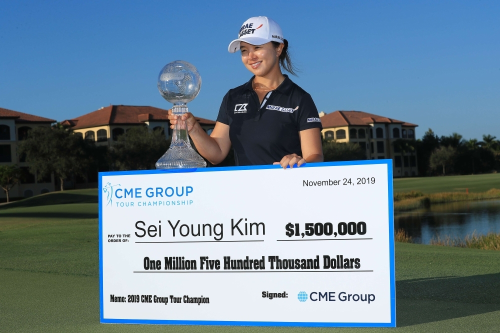 Kim Sei-young of South Korea poses with the CME Globe trophy and winner's check after winning the CME Group Tour Championship at Tiburon Golf Club in Naples, Florida, Florida, on Sunday. — AFP