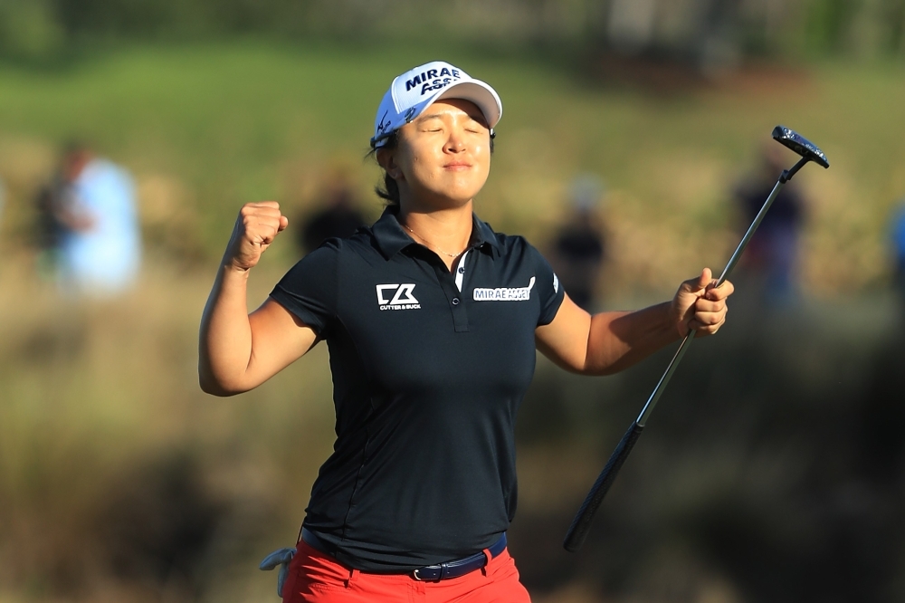 Kim Sei-young of South Korea poses with the CME Globe trophy and winner's check after winning the CME Group Tour Championship at Tiburon Golf Club in Naples, Florida, Florida, on Sunday. — AFP