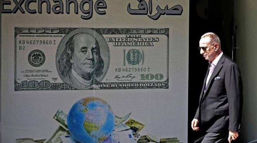 A man walks past a money exchange in Beirut in this file photo. — AFP