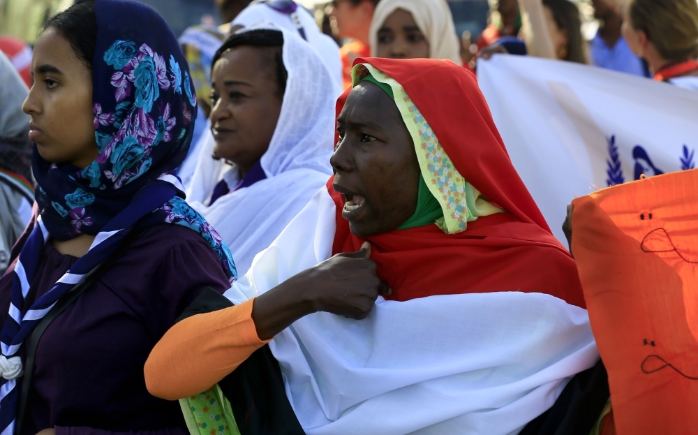 Sudanese women march in Khartoum to mark International Day for Eliminating Violence against Women, in the first such rally held in the northeast African country in decades, on Monday. — AFP