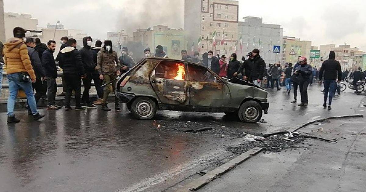 Iranian protesters gather around a burning car during a demonstration against an increase in gasoline prices in Tehran in this Nov. 16, 2019 file photo. — AFP  