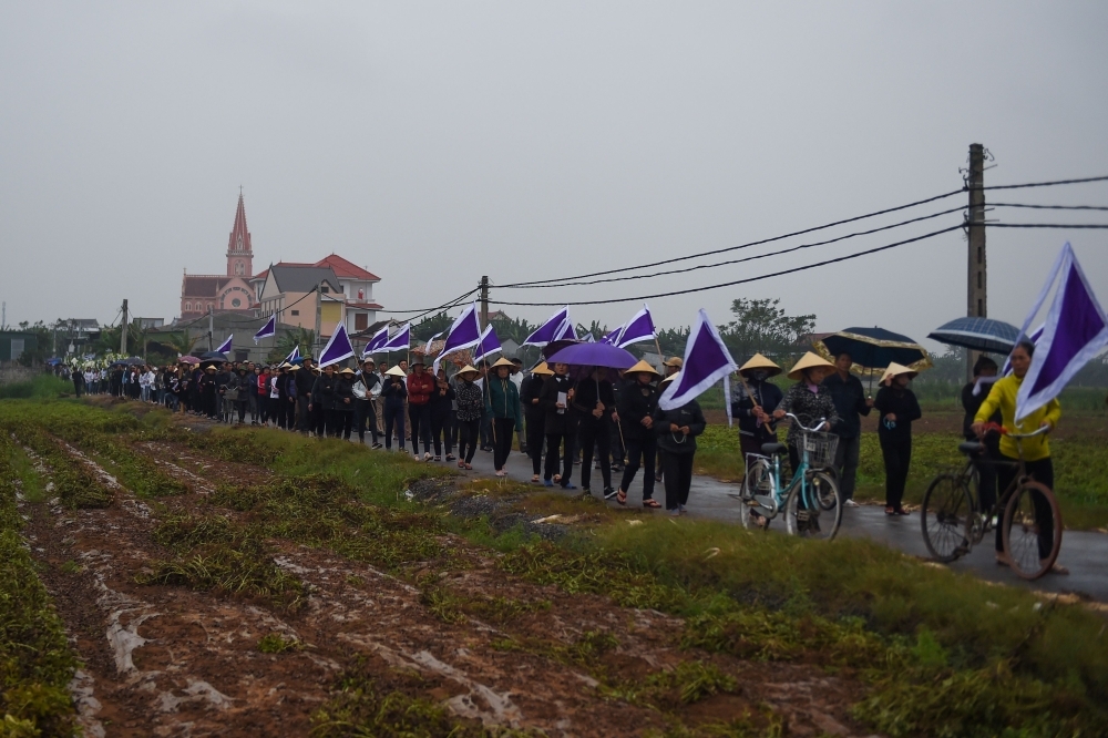 A family members of Nguyen Van Hung cry during burial of his remains at a cemetery in Dien Chau district, Nghe An province, Vietnam, on Thursday. — AFP