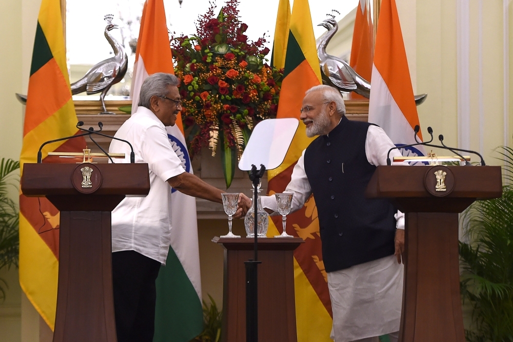 Sri Lanka's President Gotabaya Rajapaksa shakes hands with India's Prime Minister Narendra Modi, right, during a joint media briefing at the Hyderadad House in New Delhi on Friday. — AFP