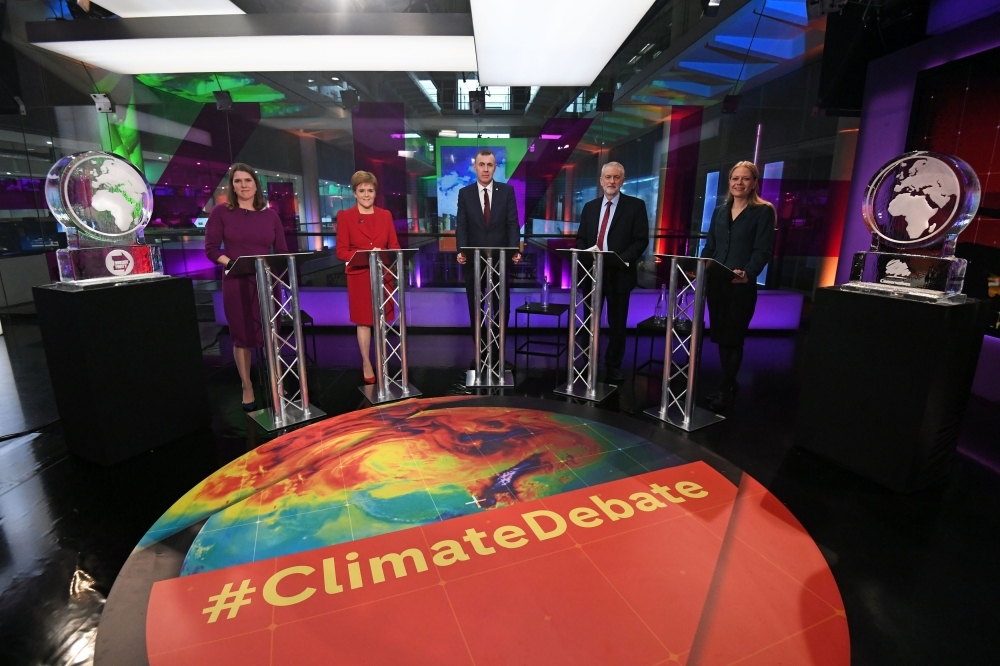 An ice sculpture is put in place for the non-attending Britain's Prime Minister Boris Johnson at a photo-call ahead of the Channel 4 News Climate Debate in London on Thursday. — AFP