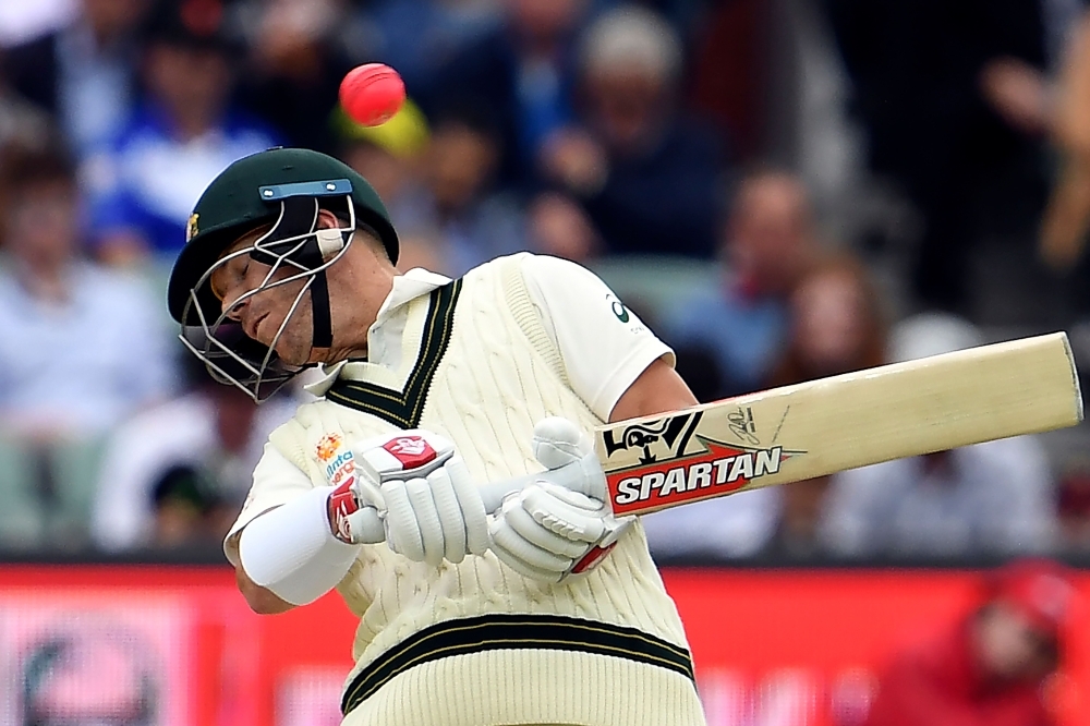 Australia's batsman David Warner ducks under a bouncer from Pakistan's paceman Muhammad Musa on day one of the second cricket Test match between Australia and Pakistan in Adelaide on Friday. — AFP