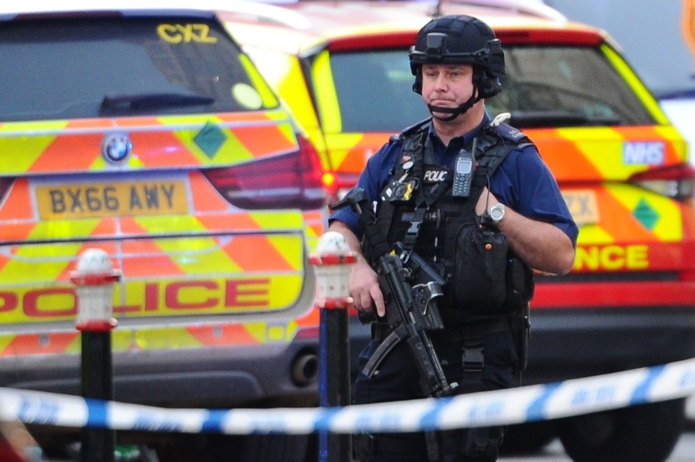 An armed police officer covers a cordon near London Bridge in London on Friday. — AFP