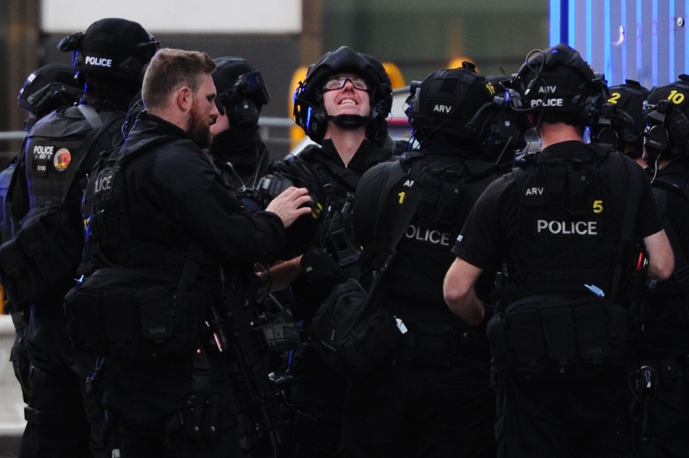 An armed police officer covers a cordon near London Bridge in London on Friday. — AFP