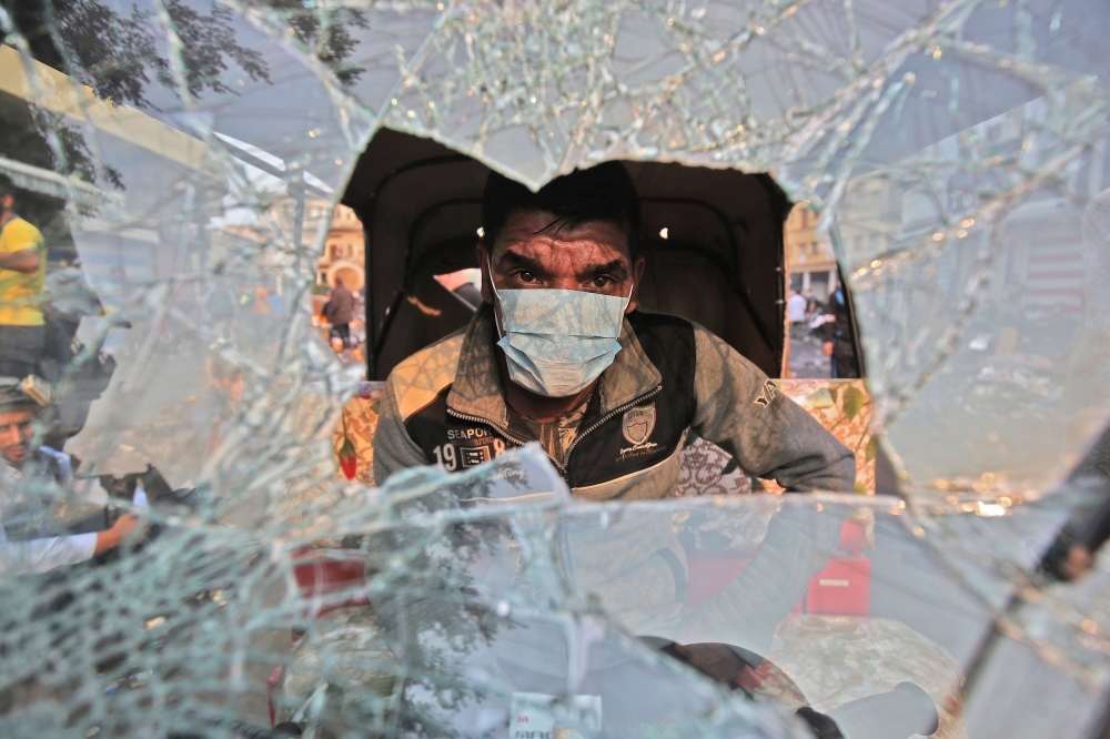 Iraqi demonstrators clash with security forces in Karbala on Friday. -AFP