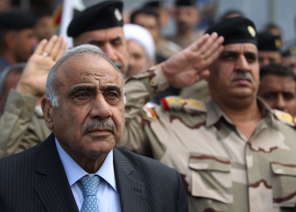 Iraqi demonstrators clash with security forces in Karbala on Friday. -AFP