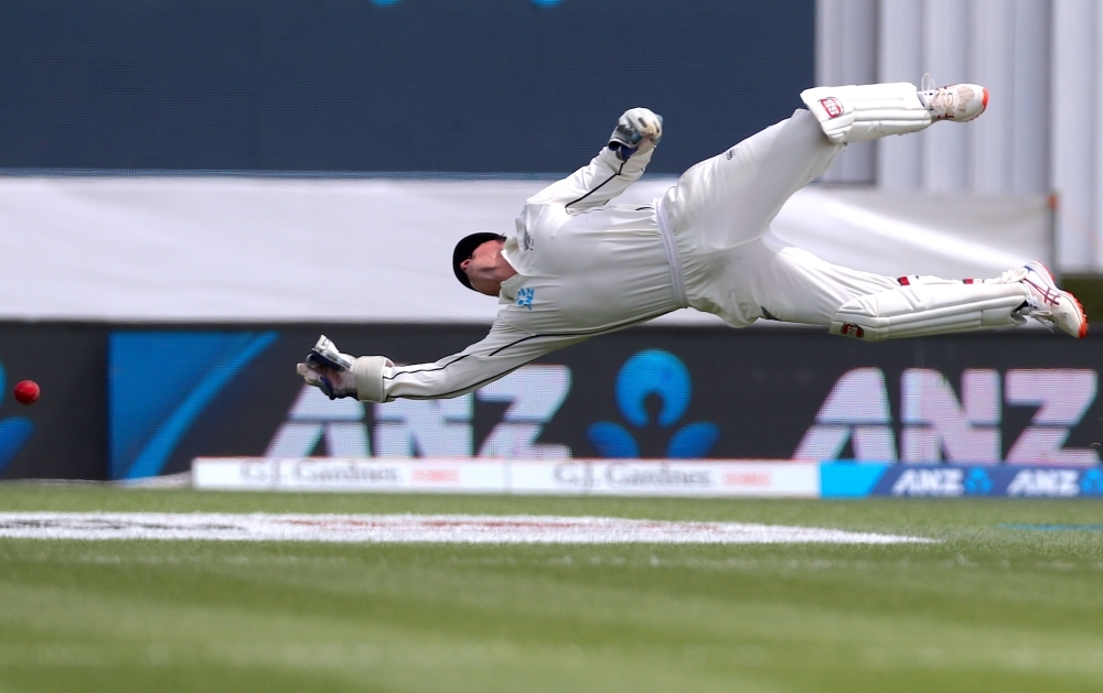 New Zealand's wicketkeeper BJ Watling dives but fails to take a catch from England's Rory Burns during the third day of the second cricket Test between England and New Zealand at Seddon Park in Hamilton, on Sunday. — AFP