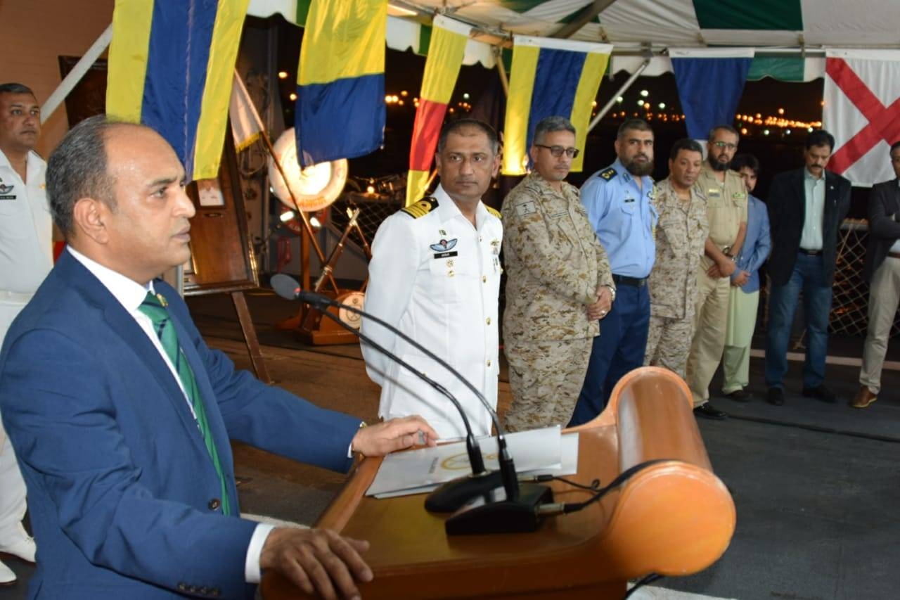 Saudi and Pakistani Naval officers, along with the consul general, commemorate the day by cutting a Pak-Saudi friendship cake.