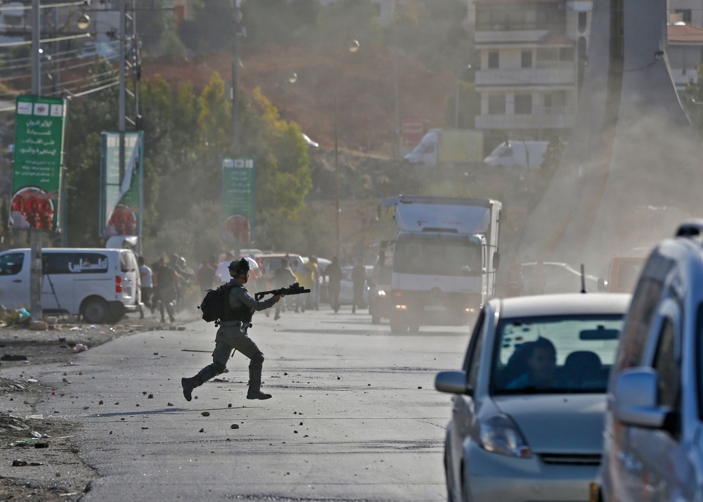 Israeli security forces clash with Palestinian demonstrators in the West Bank city of Ramallah in this Nov. 26, 2019 file photo. — AFP