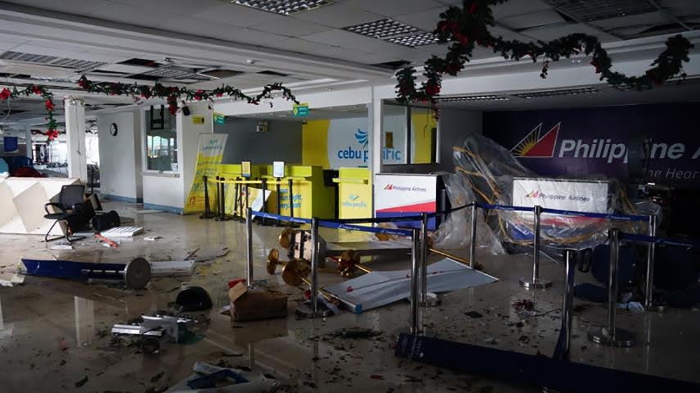 Debris litter inside the passenger terminal, after one of its walls was destroyed in Legaspi City, Albay province, south of Manila on Tuesday, after Typhoon Kamurri battered the province. — AFP