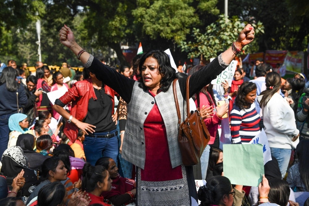 Social activists and supporters shout slogans to protest against the alleged rape and murder of a 27-year-old veterinary doctor in Hyderabad, during a demonstration in New Delhi, on Tuesday. — AFP