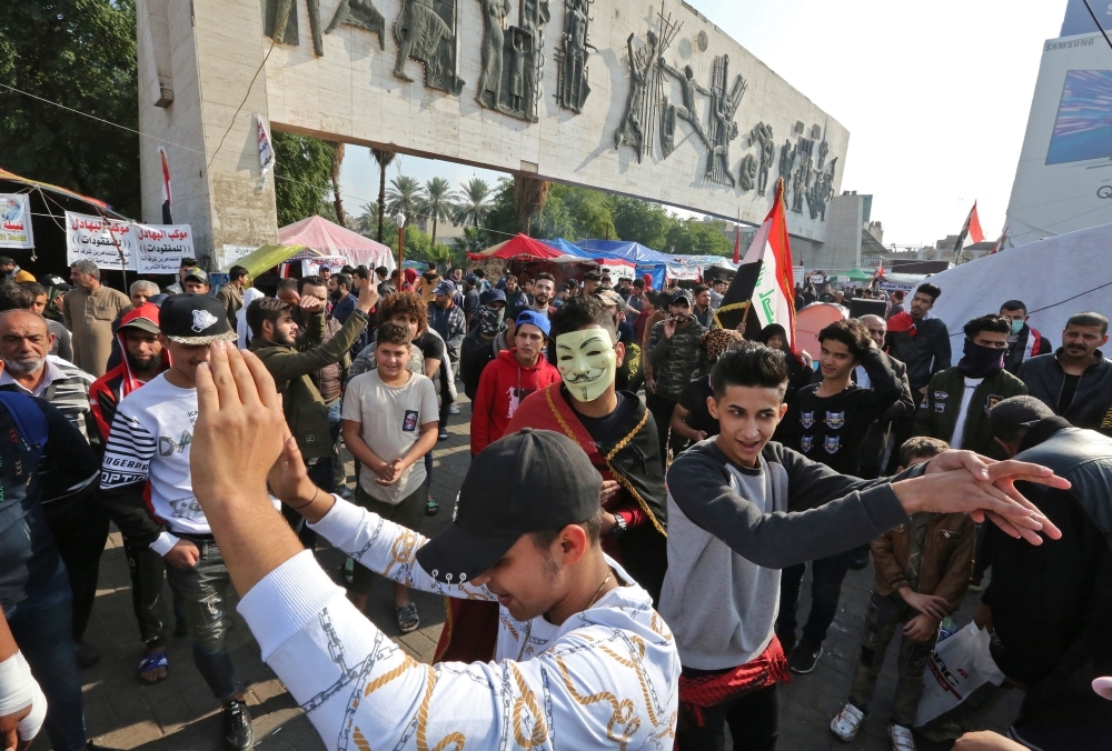 Iraqi demonstrators gather on Tahrir square in the capital Baghdad, amid ongoing anti-government protests, on Wednesday. — AFP