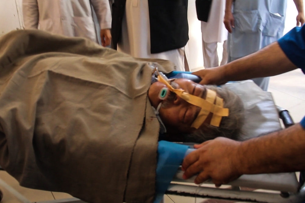 Hospital staff transfer Japanese doctor Tetsu Nakamura on a stretcher for treatment after being injured in an attack in Jalalabad, Afghanistan, on Wednesday. — AFP