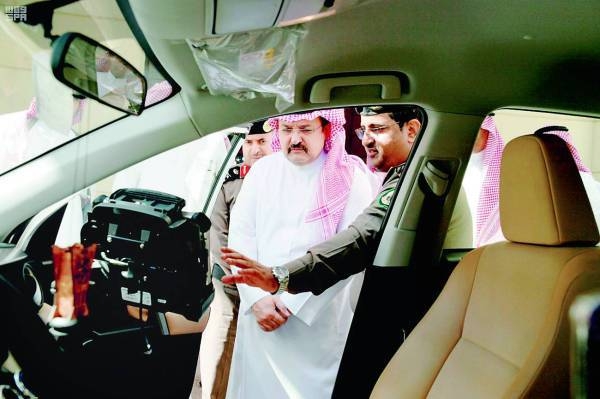 Jeddah Governor Prince Mishal Bin Majed inspects a sophisticated speeding detection system mounted in a Jeddah Traffic Department civilian vehicle. — Okaz photo