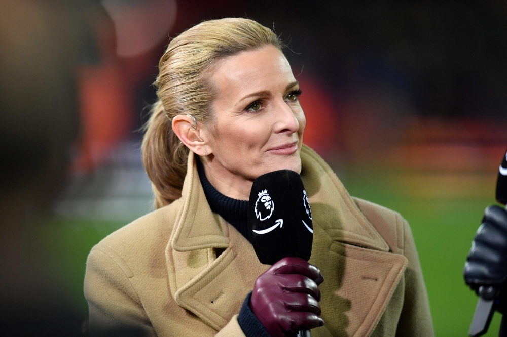 Television presenter Gabby Logan, working for Amazon Prime TV, works on the pitch ahead of the English Premier League football match between Liverpool and Everton at Anfield in Liverpool, north west England on Wednesday.  — AFP