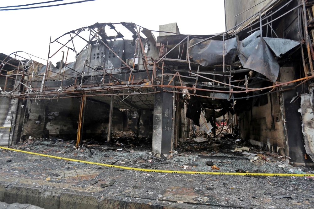 Shops that were destroyed during demonstrations against petrol price hikes, are pictured in Shahriar, west of Tehran, in this Nov. 20, 2019  file photo. — AFP