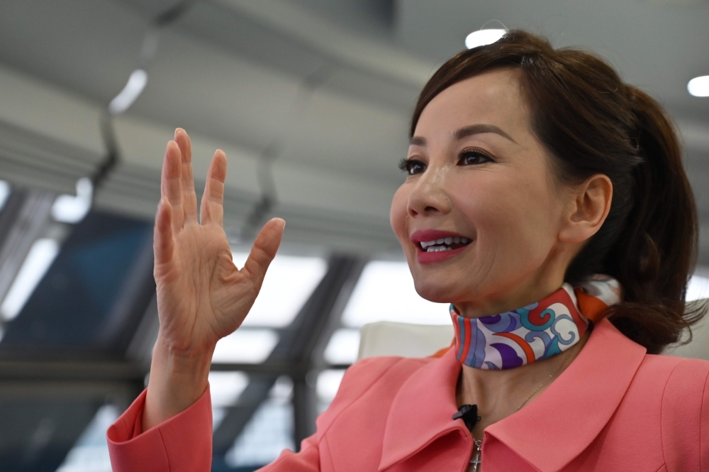In this file photo taken on April 26, 2019 Travel services company CEO of Trip.com Jane Jie Sun Jie speaks during an interview with AFP in the facilities of Ctrip in Shanghai. The head of Chinese travel giant Trip.com, Jane Sun, is on a mission to propel women through her workforce, spearheading novel approaches. — AFP