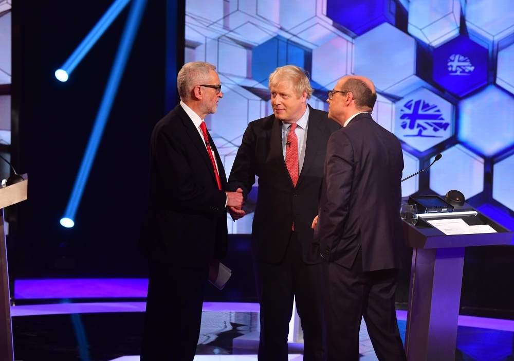  Britain's Prime Minister Boris Johnson (R) and Britain's main opposition Labour Party leader Jeremy Corbyn participate in the BBC Prime Ministerial leaders debate, at the studio in Maidstone, Kent on Friday. -AFP