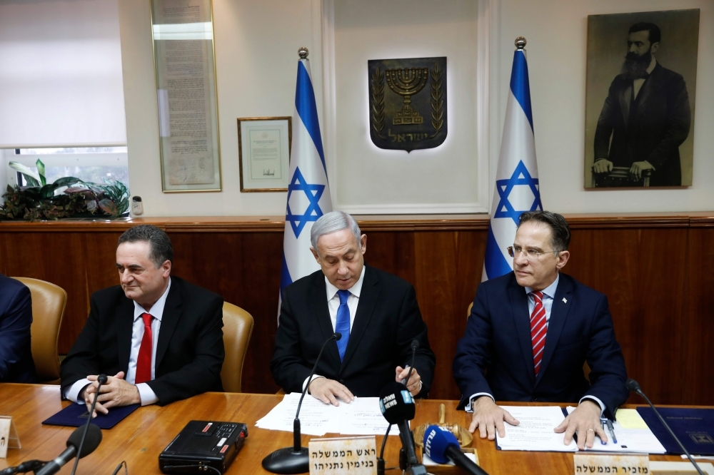 Israeli Prime Minister Benjamin Netanyahu, center, chairs the weekly Cabinet meeting in Jerusalem on Sunday. — AFP